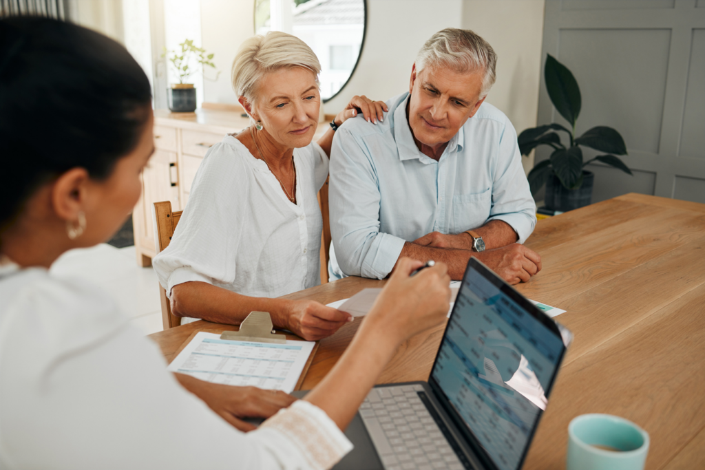 Financial advisor consultation with clients on retirement, finance planning or investment and document on laptop screen.