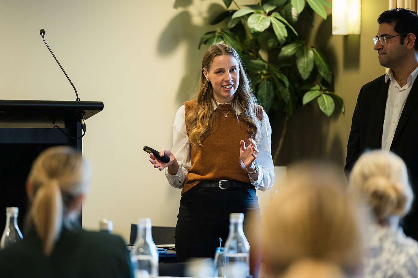 Female Nexia employee presenting at industry confernce