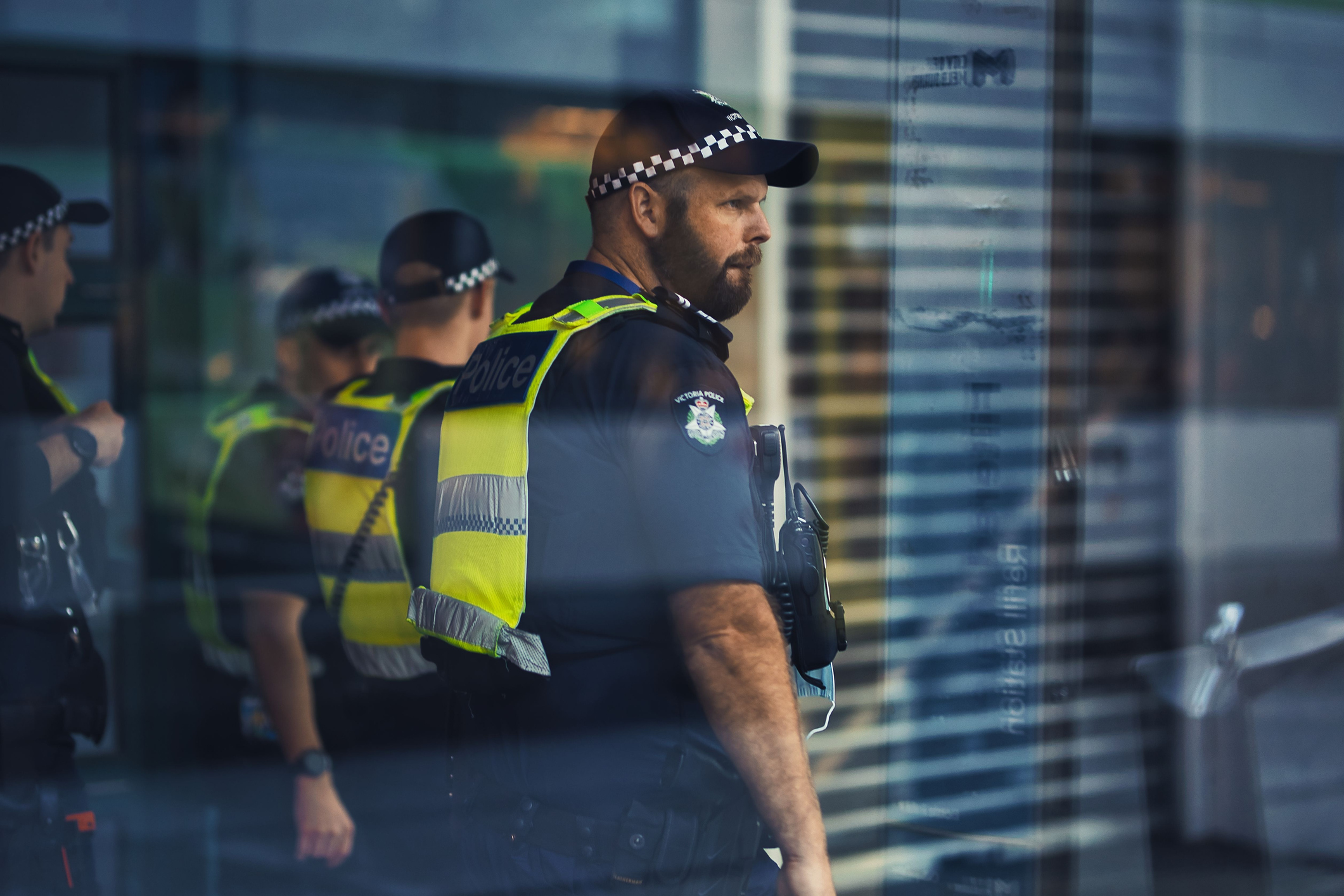 A street photo of Victoria police, view through glass window