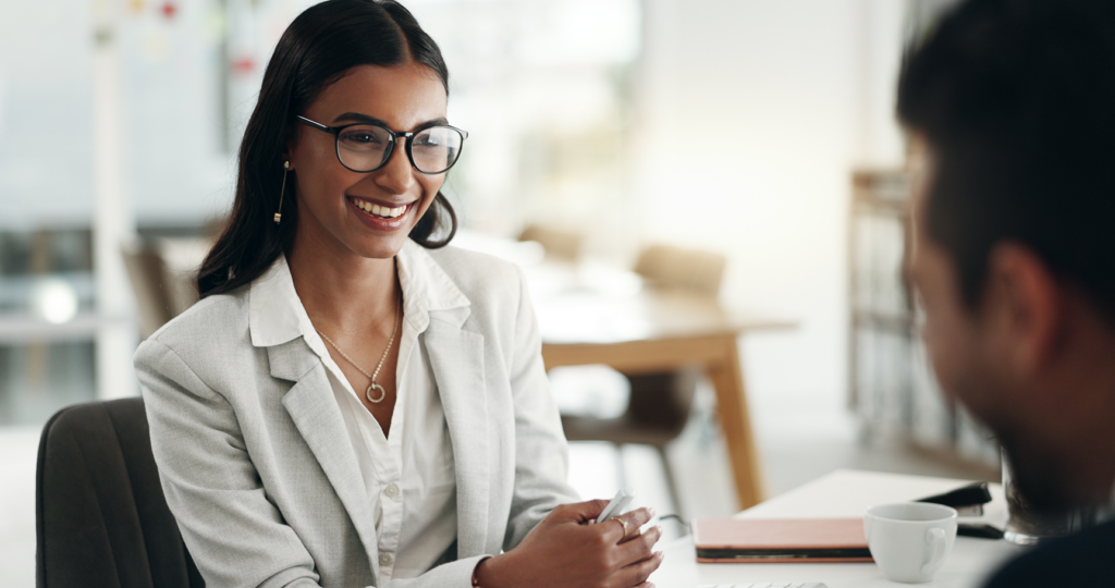 Woman with glasses having a professional meeting with a man