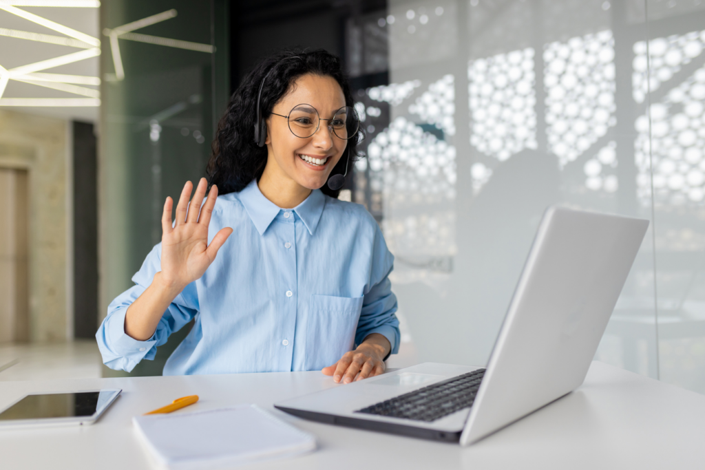 Woman wearing headset holding professional business meeting online