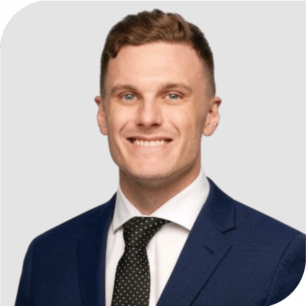 Joe Cunningham in a navy suit and spotted tie.