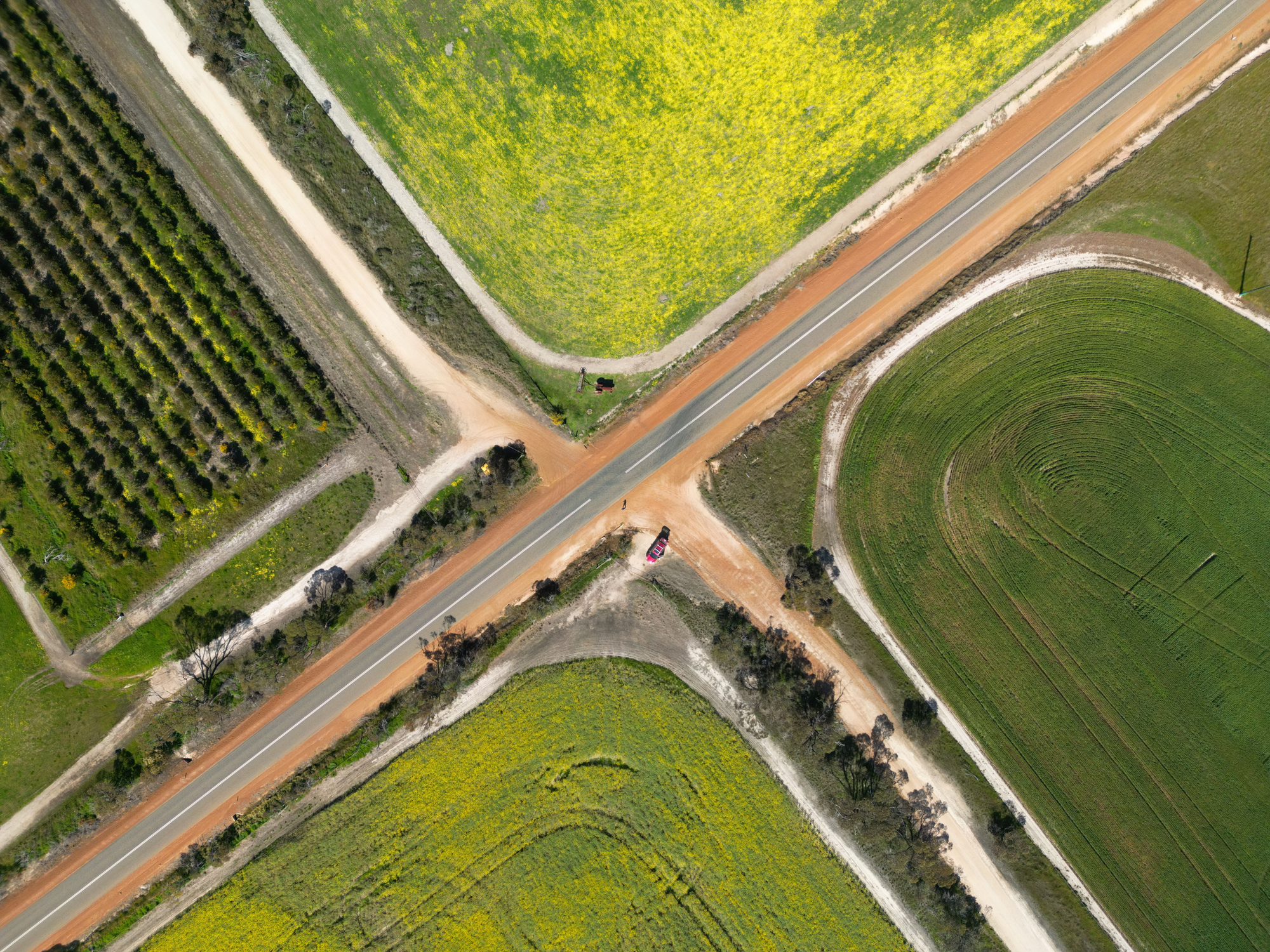 Aerial view of a rural intersection with roads and paddocks